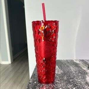 Red Starbucks cup.